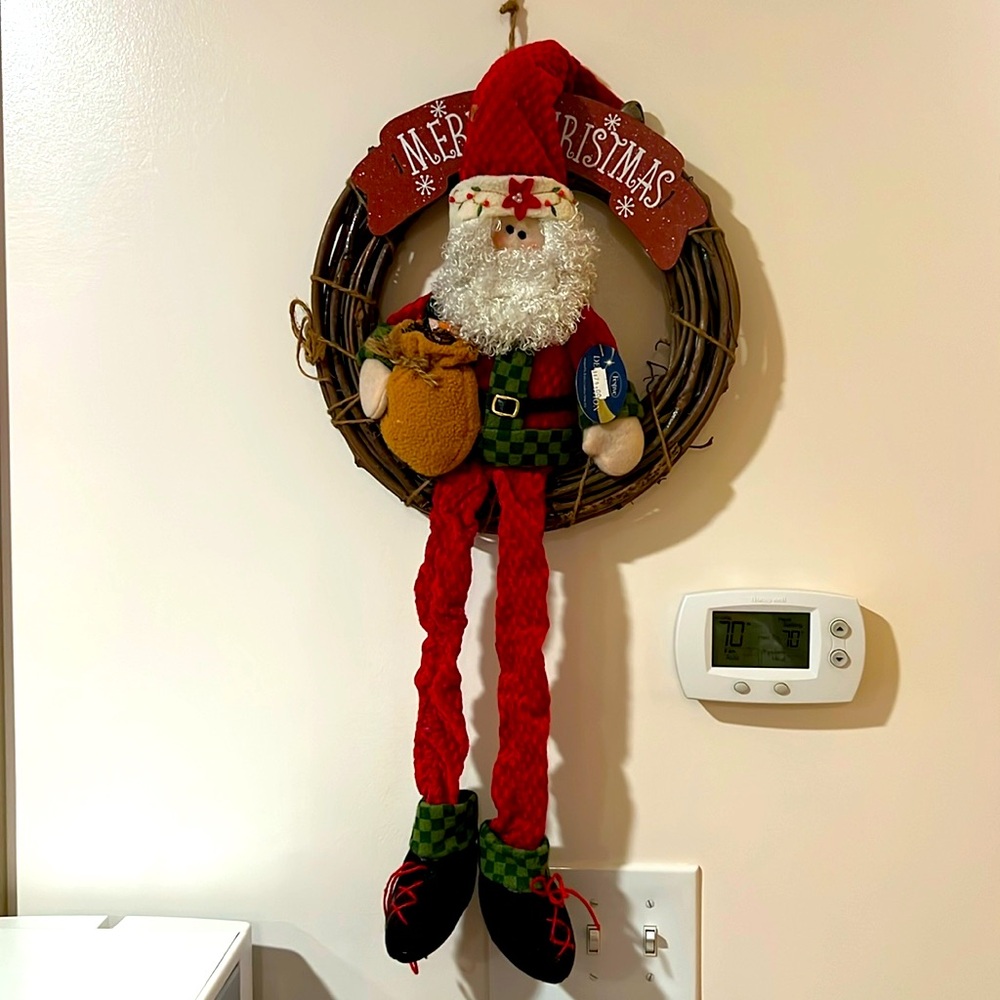 Festive. Merry Christmas. Sitting Santa Claus on the Wooden Bench.